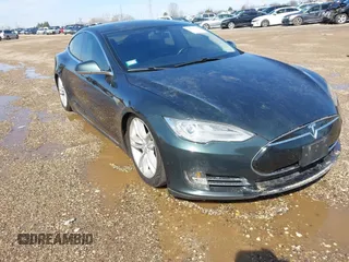 2014 Tesla Model S 60 with VIN 5YJSA1H18EFP50389, listed as a IAAI auction lot 41864195 with Not Provided miles and . Bid and sale history available at DreamBid. Image 1.