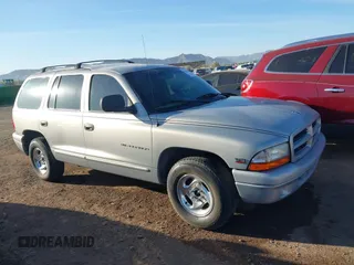 1999 Dodge Durango z VIN 1B4HR28Z6XF539301, wystawiony jako IAAI lot #41589424 z przebiegiem 127 753 mil mil oraz . Historia ofert i sprzedaży dostępna na DreamBid. Obrazek 1.