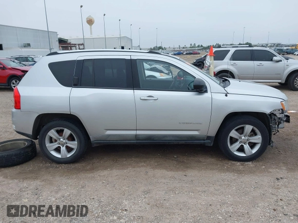 2011 Jeep Compass with VIN 1J4NT1FA7BD142600, listed as a IAAI auction lot 41590661 with 266,600 mi miles. Bid and sale history available at carsss.com. Image 14.