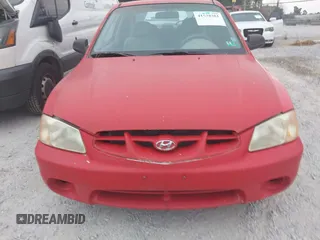 2002 Hyundai Accent GL with VIN KMHCG35C32U157056, listed as a IAAI auction lot 41538381 with 127,518 mi miles. Bid and sale history available at carsss.com. Image 6.