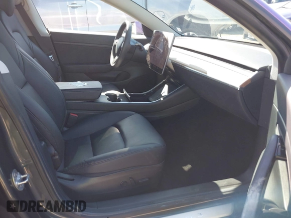 2020 Tesla Model 3 Standard Range Plus with VIN 5YJ3E1EA0LF739462, listed as a IAAI auction lot 42081889 with 65,254 mi miles. Bid and sale history available at carsss.com. Image 5.