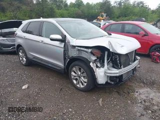 2019 Ford Edge Titanium z VIN 2FMPK3K9XKBB70482, wystawiony jako IAAI lot #41971276 z przebiegiem 84 819 mil mil oraz . Historia ofert i sprzedaży dostępna na DreamBid. Obrazek 1.
