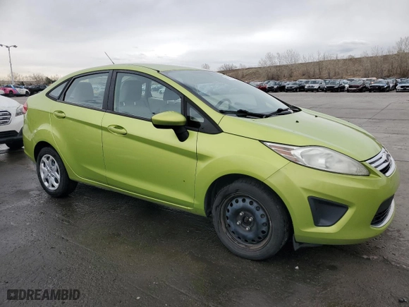 2011 Ford Fiesta SE with VIN 3FADP4BJ7BM144452, listed as a Copart auction lot 51183115 with 122,910 mi miles and Salvage Title. Bid and sale history available at carsss.com. Image 4.