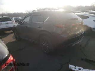 2021 Mazda CX-5 Signature with VIN JM3KFBEY2M0345187, listed as a Copart auction lot 82786984 with 98,014 mi miles and Salvage Title. Bid and sale history available at carsss.com. Image 2.