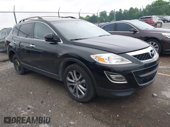 2012 Mazda CX-9 Grand Touring z VIN JM3TB2DAXC0338667, wystawiony jako IAAI lot #42260820 z przebiegiem 138 111 mil mil oraz . Historia ofert i sprzedaży dostępna na DreamBid. Obrazek 1.