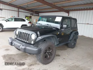 2015 Jeep Wrangler Sport with VIN 1C4AJWAG8FL550635, listed as a IAAI auction lot 42116285 with 111,782 mi miles. Bid and sale history available at carsss.com. Image 2.