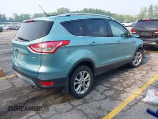 2013 Ford Escape Titanium with VIN 1FMCU9J99DUD63037, listed as a IAAI auction lot 42436605 with 168,200 mi miles and . Bid and sale history available at DreamBid. Image 4.