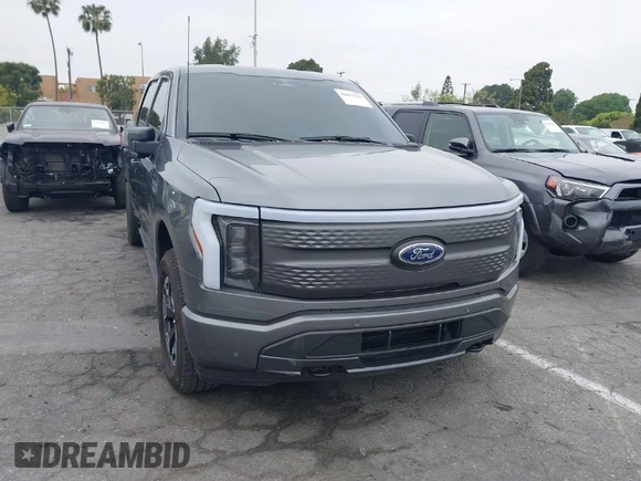 2023 Ford F-150 Lightning Pro with VIN 1FTVW1EL8PWG48559, listed as a IAAI auction lot 42033123 with 8,845 mi miles and . Bid and sale history available at DreamBid. Image 1.