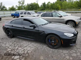 2015 BMW M6 z VIN WBS6C9C59FD467652, wystawiony jako Copart lot #66093293 z przebiegiem Nie podano mil oraz . Historia ofert i sprzedaży dostępna na DreamBid. Obrazek 4.
