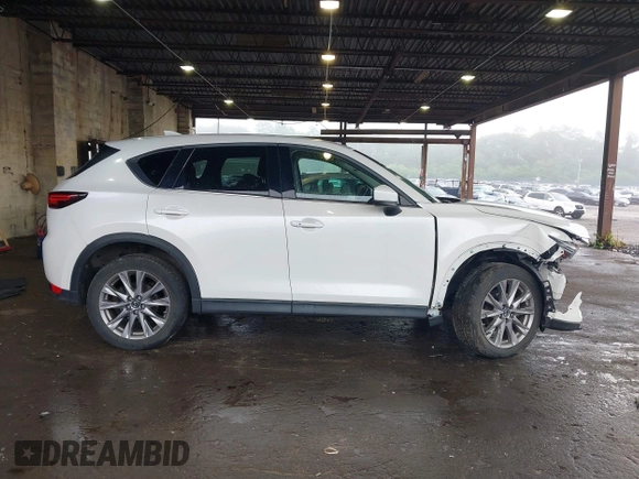 2019 Mazda CX-5 Grand Touring with VIN JM3KFBDMXK0648813, listed as a IAAI auction lot 42524680 with 23,521 mi miles and . Bid and sale history available at DreamBid. Image 14.