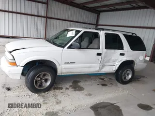 2004 Chevrolet Blazer LS z VIN 1GNDT13X64K129093, wystawiony jako IAAI lot #41860109 z przebiegiem 175 588 mil mil oraz . Historia ofert i sprzedaży dostępna na DreamBid. Obrazek 14.