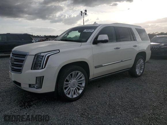 2015 Cadillac Escalade Platinum z VIN 1GYS4PKJ5FR574930, wystawiony jako Copart lot #74691204 z przebiegiem Nie podano mil oraz Szkoda całkowita • Salvage title. Historia ofert i sprzedaży dostępna na DreamBid. Obrazek 1.