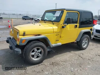 2000 Jeep Wrangler Sport with VIN 1J4FA49S2YP768451, listed as a IAAI auction lot 42136785 with 74,492 mi miles. Bid and sale history available at carsss.com. Image 2.