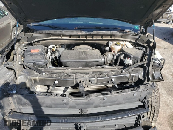2023 Chevrolet Suburban LS with VIN 1GNSCBKD8PR163178, listed as a Copart auction lot 47844175 with 104,369 mi miles and Salvage Title. Bid and sale history available at DreamBid. Image 12.
