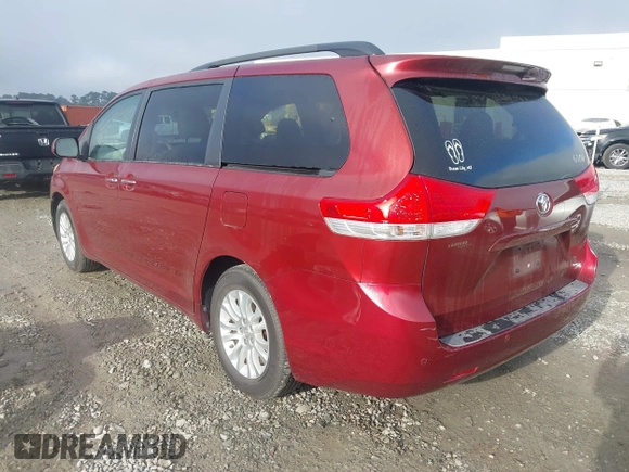2014 Toyota Sienna XLE with VIN 5TDYK3DCXES471676, listed as a IAAI auction lot 41853038 with 169,790 mi miles. Bid and sale history available at carsss.com. Image 3.