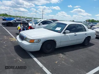 2001 Mercury Grand Marquis LS with VIN 2MEFM75W71X614856, listed as a IAAI auction lot 42195921 with 113,352 mi miles and . Bid and sale history available at DreamBid. Image 2.