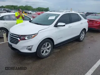 2021 Chevrolet Equinox Premier with VIN 3GNAXNEV5MS160043, listed as a IAAI auction lot 42109564 with 36,808 mi miles and . Bid and sale history available at DreamBid. Image 2.
