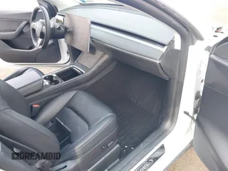 2021 Tesla Model Y Performance with VIN 5YJYGDEF1MF262930, listed as a IAAI auction lot 41606321 with 28,882 mi miles and . Bid and sale history available at DreamBid. Image 5.