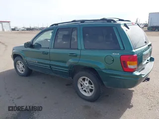 1999 Jeep Grand Cherokee Limited with VIN 1J4GW68N4XC544651, listed as a IAAI auction lot 41742346 with 94,904 mi miles and . Bid and sale history available at DreamBid. Image 3.