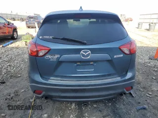 2015 Mazda CX-5 Touring with VIN JM3KE4CY0F0446748, listed as a Copart auction lot 51924585 with 111,402 mi miles and Clean Title. Bid and sale history available at DreamBid. Image 6.