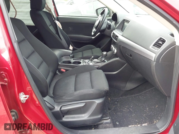 2016 Mazda CX-5 Touring z VIN JM3KE2CY3G0894441, wystawiony jako IAAI lot #41508767 z przebiegiem 88 554 mil mil oraz . Historia ofert i sprzedaży dostępna na DreamBid. Obrazek 5.