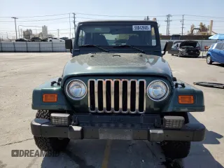 2000 Jeep Wrangler Sahara z VIN 1J4FA59S1YP746043, wystawiony jako Copart lot #58842665 z przebiegiem 148 348 mil mil oraz Szkoda całkowita • Salvage title. Historia ofert i sprzedaży dostępna na DreamBid. Obrazek 5.