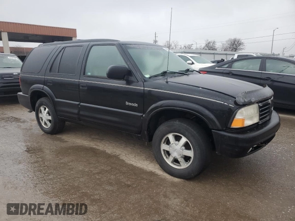2000 Oldsmobile Bravada z VIN 1GHDT13W5Y2311819, wystawiony jako Copart lot #44839145 z przebiegiem 163 427 mil mil oraz Tytuł czysty. Historia ofert i sprzedaży dostępna na DreamBid. Obrazek 4.