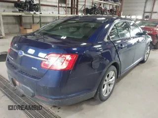 2011 Ford Taurus SEL with VIN 1FAHP2EW7BG174493, listed as a IAAI auction lot 41697856 with 143,957 mi miles. Bid and sale history available at carsss.com. Image 4.