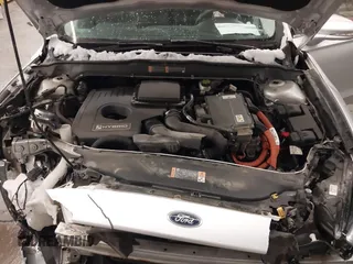 2016 Ford Fusion SE Hybrid z VIN 3FA6P0LU1GR304166, wystawiony jako IAAI lot #41932720 z przebiegiem 68 058 mil mil oraz . Historia ofert i sprzedaży dostępna na DreamBid. Obrazek 10.