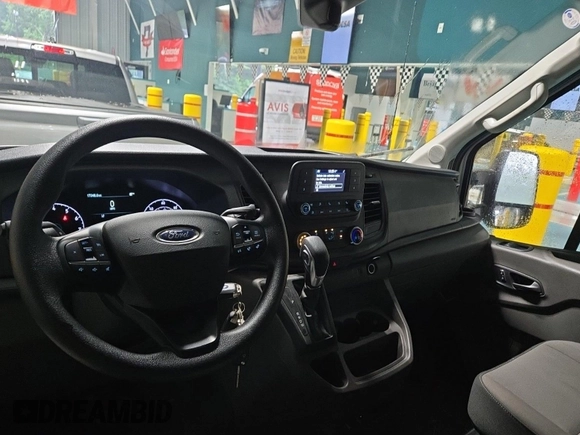 2023 Ford Transit Cargo with VIN 1FTBR1X87PKC01635, listed as a IAAI auction lot 42832727 with 17,348 mi miles and . Bid and sale history available at DreamBid. Image 2.