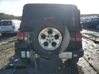 2015 Jeep Wrangler Unlimited Sahara with VIN 1C4BJWEG3FL530114, listed as a Copart auction lot 88851565 with 156,669 mi miles and Salvage Title. Bid and sale history available at carsss.com. Image 6.
