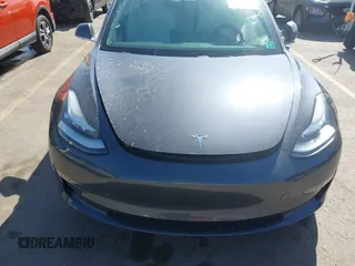 2018 Tesla Model 3 Long Range Battery with VIN 5YJ3E1EBXJF055203, listed as a IAAI auction lot 42019770 with 57,379 mi miles and . Bid and sale history available at DreamBid. Image 12.