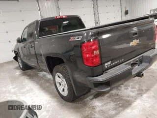 2016 Chevrolet Silverado 1500 LT with VIN 1GCVKREC0GZ303387, listed as a IAAI auction lot 41978237 with 123,692 mi miles and . Bid and sale history available at DreamBid. Image 3.