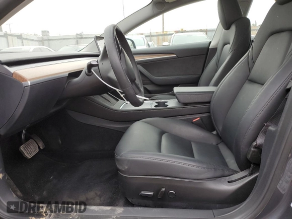 2023 Tesla Model 3 with VIN 5YJ3E1EA3PF697049, listed as a Copart auction lot 55601295 with 12,373 mi miles and Salvage Title. Bid and sale history available at DreamBid. Image 7.