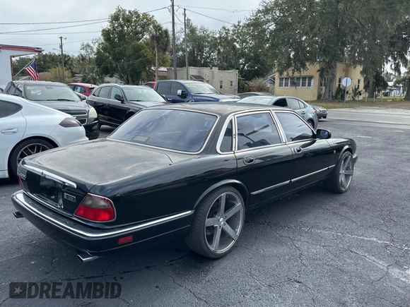 1995 Jaguar XJ with VIN SAJHX174XSC738291, listed as a Copart auction lot 87054224 with 71,076 mi miles and Clean title. Bid and sale history available at DreamBid. Image 4.