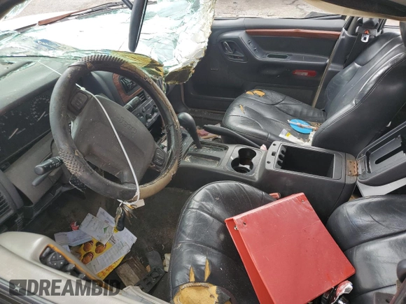 1999 Jeep Grand Cherokee Limited with VIN 1J4G268S2XC756532, listed as a Copart auction lot 71222174 with 279,300 mi miles and Salvage title. Bid and sale history available at DreamBid. Image 7.