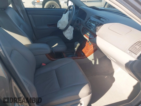 2005 Toyota Camry LE with VIN 4T1BF30K55U619313, listed as a IAAI auction lot 41854001 with 89,982 mi miles and . Bid and sale history available at DreamBid. Image 5.