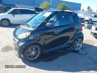 2014 Smart fortwo Pure with VIN WMEEJ3BA0EK740736, listed as a IAAI auction lot 41446173 with 68,530 mi miles and . Bid and sale history available at DreamBid. Image 2.