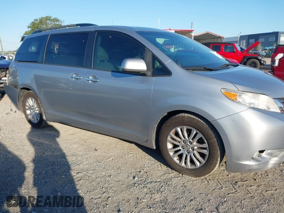 2015 Toyota Sienna XLE with VIN 5TDYK3DC9FS610925, listed as a IAAI auction lot 42022267 with 153,997 mi miles. Bid and sale history available at carsss.com. Image 1.