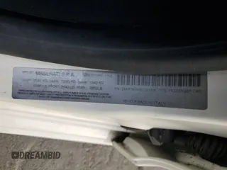 2014 Maserati Ghibli z VIN ZAM57XSA6E1097525, wystawiony jako Copart lot #42029695 z przebiegiem 93 740 mil mil oraz Szkoda całkowita • Salvage title. Historia ofert i sprzedaży dostępna na DreamBid. Obrazek 12.