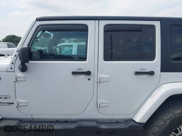 2018 Jeep Wrangler Unlimited Sahara with VIN 1C4HJWEG1JL801934, listed as a IAAI auction lot 42072968 with 112,432 mi miles and . Bid and sale history available at DreamBid. Image 14.