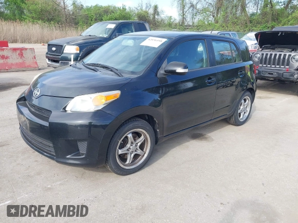 2009 Scion xD with VIN JTKKU10409J041654, listed as a IAAI auction lot 42036558 with 122,661 mi miles. Bid and sale history available at carsss.com. Image 2.