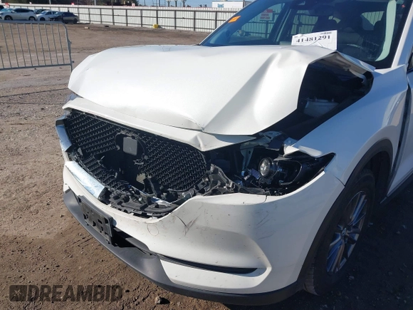 2019 Mazda CX-5 Touring with VIN JM3KFACM4K1668352, listed as a IAAI auction lot 41481291 with 65,901 mi miles and . Bid and sale history available at carsss.com. Image 6.