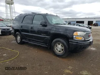 2003 GMC Yukon Denali z VIN 1GKEK63U43J263449, wystawiony jako Copart lot #53848345 z przebiegiem 144 280 mil mil oraz Szkody całkowita. Historia ofert i sprzedaży dostępna na DreamBid. Obrazek 4.