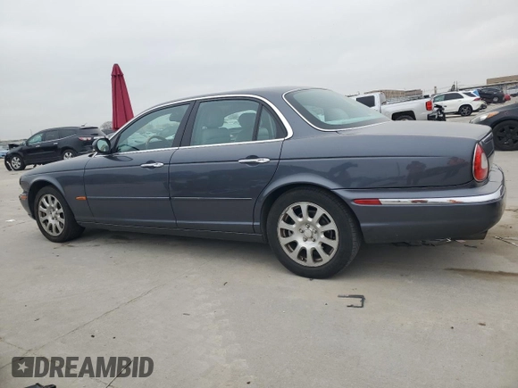 2004 Jaguar XJ with VIN SAJWA71C04SG22878, listed as a Copart auction lot 44383205 with 127,515 mi miles and Clean Title. Bid and sale history available at carsss.com. Image 2.