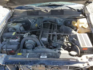 1997 Jeep Grand Cherokee Laredo with VIN 1J4GZ58S5VC561060, listed as a Copart auction lot 52098315 with 267,245 mi miles and Salvage title. Bid and sale history available at DreamBid. Image 13.