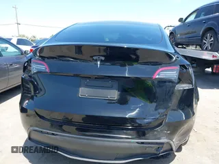 2024 Tesla Model Y with VIN 7SAYGDED9RF191453, listed as a IAAI auction lot 42272051 with 7,805 mi miles and . Bid and sale history available at DreamBid. Image 17.