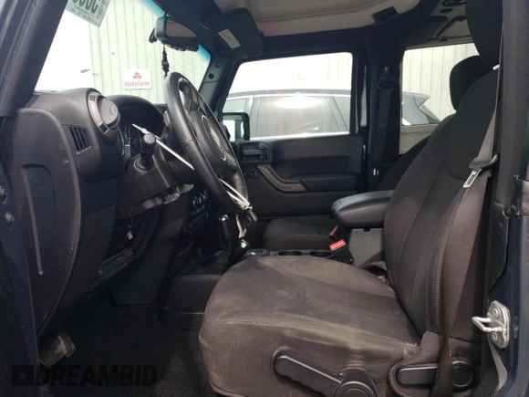 2017 Jeep Wrangler Sport with VIN 1C4AJWAGXHL540496, listed as a Copart auction lot 50692705 with 115,042 mi miles and Salvage Title. Bid and sale history available at DreamBid. Image 7.