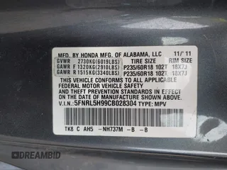 2012 Honda Odyssey Touring with VIN 5FNRL5H99CB028304, listed as a IAAI auction lot 42031916 with 216,185 mi miles and . Bid and sale history available at DreamBid. Image 9.