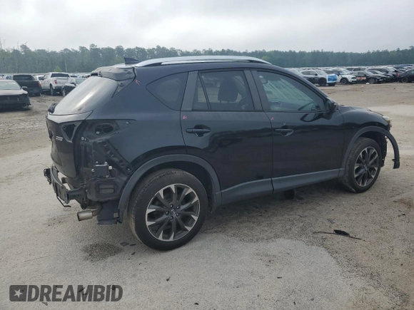 2016 Mazda CX-5 Grand Touring z VIN JM3KE2DY5G0676290, wystawiony jako Copart lot #54155325 z przebiegiem 124 743 mil mil oraz Szkoda całkowita • Salvage title. Historia ofert i sprzedaży dostępna na DreamBid. Obrazek 3.